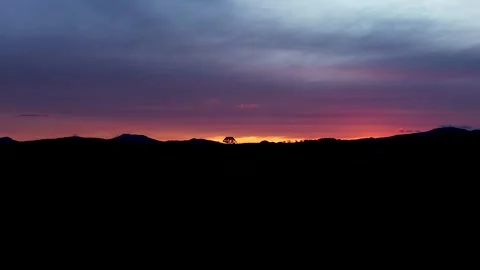 Aerial view of sunset over mountains in Brazil Stock Footage 329176233