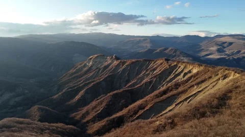 Aerial view of Sunset over a mountaintop chape Video stock 272233102