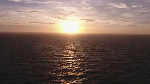 Aerial view of a sunset over the ocean, seagull silhouette in France. Stock Footage