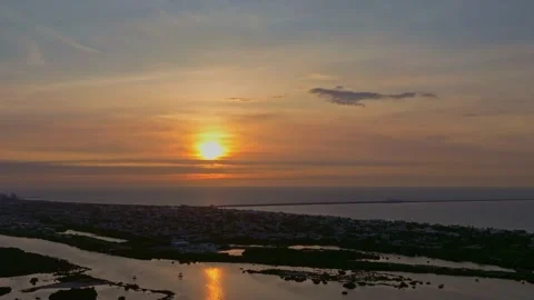 Aerial view of sunset over ocean and cityscape, Mexico. Stock-Footage 284847620