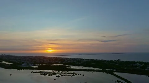 Aerial view of sunset over ocean and city, Mexico. 스톡 동영상 284847679