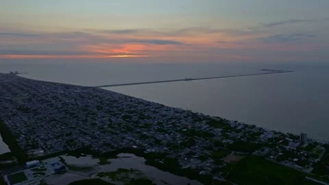 Aerial view of sunset over ocean and city, Mexico. Stock Footage 284847747