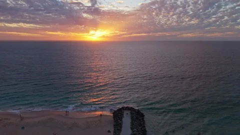 Aerial view of sunset over Perth beach in Western Australia with sun rays Stock Footage 332137675