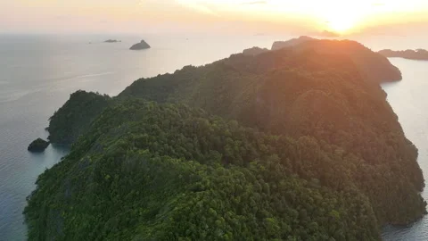 Aerial View of Sunset Over Remote Limestone Islands in Raja Ampat Stock-Footage 240768553