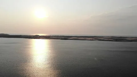 Aerial view of sunset over Silver Lake near Little Sable Point Michigan Stock Footage 142177936