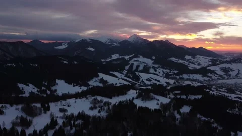 Aerial view sunset over winter mountain ,trees landscape, colored clouds at dusk Stock-Footage 170816260