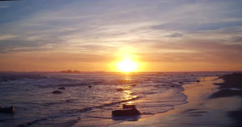 Aerial View Sunset into Pacific Ocean. Flying Low Over Water Stock Footage 62970593