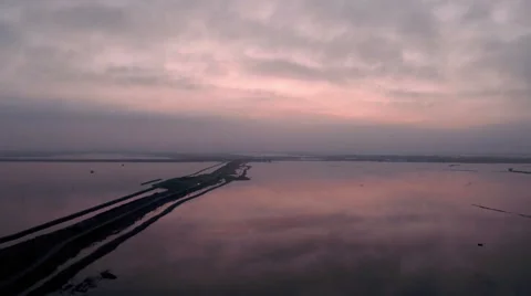 Aerial view of sunset reflection on lake in Italy Stock Footage 47947538