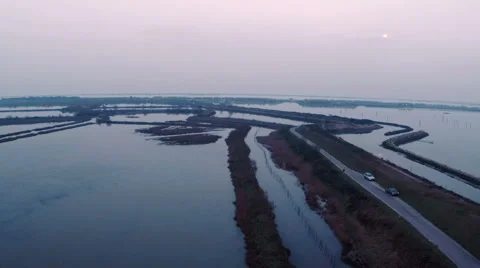 Aerial view of sunset reflection on lake in Italy Video stock 47947658