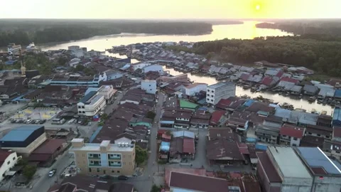 Aerial view of sunset, river and residential area at Perak Stock Footage 152562280