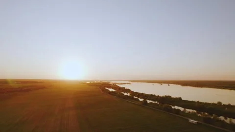 Aerial view of sunset on a river, river in the setting sun Stock Footage 313467049