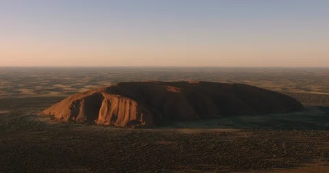 Aerial view of sunset shadows on Uluru Australia Stock Footage 112883750