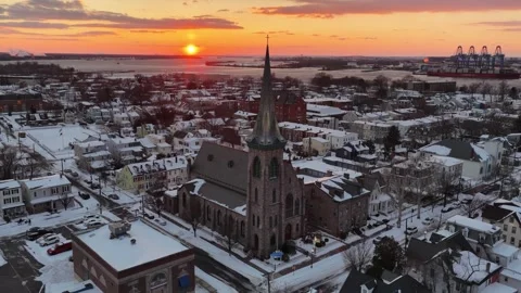 Aerial View of Sunset in the Snow Covered Delaware Riverfront Town Stock Footage 328337765