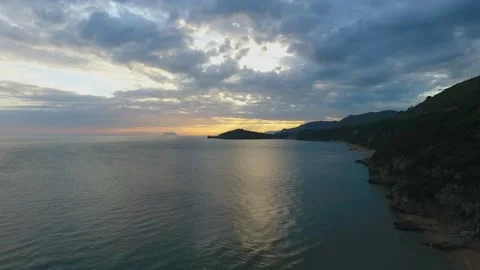 Aerial view sunset with warm colors and a blue sea, italy Stock Footage