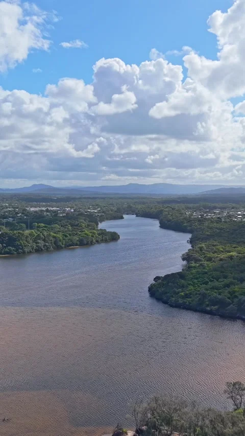 Aerial view of Sunshine Coast river estuary and wetlands with suburban skylin Stock Footage 334785264