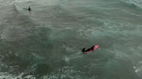 Aerial view surf instructor push pupil adult man on board towards ocean wave Stock-Footage 108860253
