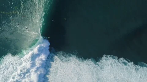 Aerial view of surfer and wave in ocean. Top view. Surfing and waves Stock Footage