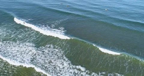 Aerial View of Surfer Riding a Long Wave The Concept of Active Lifestyle Stock-Footage 331925442