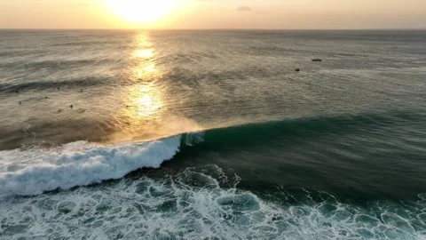 Aerial View Of Surfer Riding Wave At Sunset Drone 4K Indonesia Stock Footage 288568367