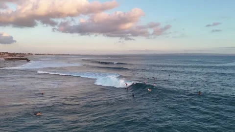 Aerial view of surfer on the wave on Canggu beach. Bali, Indonesia Stock Footage 320823326