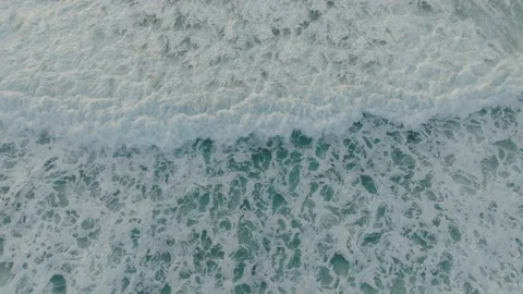 Aerial view - surfer on the waves duck dive Stock Footage 228438188