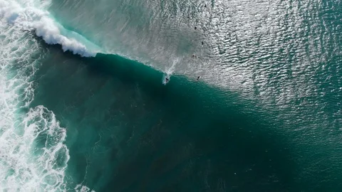 Aerial view with surfers and waves in ocean. Top view. Surfing and waves Stock Footage