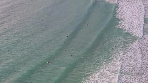 Aerial view of surfers waiting for waves in turquoise ocean at Noosa Video stock 335449876