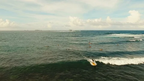 Aerial view surfers on the waves.Siargao, Philippines. Cloud 9. Stock Footage