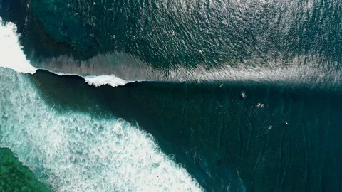 Aerial view of surfing at big waves. Blue waves in ocean and surfers Stock Footage 116817674