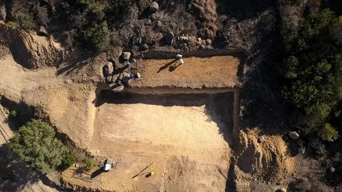 Aerial view of a surveyor working on the foundations of a house Stock Footage 100661768