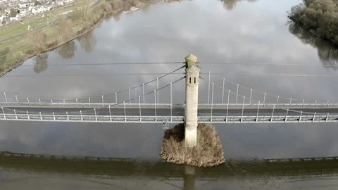 Aerial view of the suspension bridge across the river Loire in Langeais, France. Stock Footage 100034111