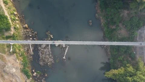 Aerial view of a suspension bridge that connects between villages in Bantul. Stock Photos