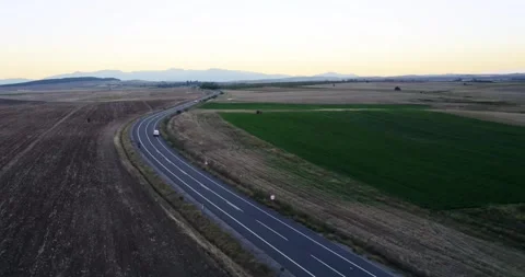 Aerial view of suspicious van make crime transportation of illegal goods on r Stock Footage 325628825