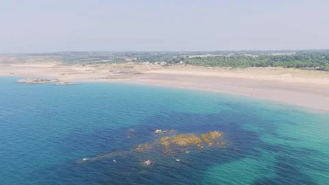 Aerial view of the sweeping coastline of Anse du Croc in Frehel, Brittany Stock Footage 346719076
