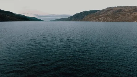 Aerial View sweeping over Large Beautiful Lake Stock Footage 85744049
