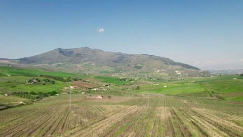 Aerial View Sweeps Over Patchwork Farmland in Rural Sicily Stock Footage 342061919