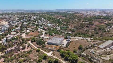 Aerial view of Swieqi Malta data centre with telecom and solar panels nearby Stock Footage 340110641
