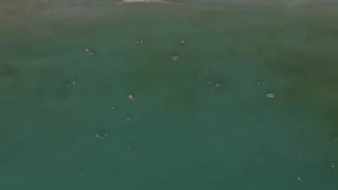 Aerial view of swimmers in the sea Stock Footage 282931292