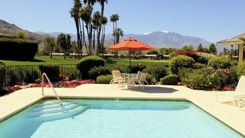 Aerial view of a swimming pool overlooking a golf course Stock Footage 105762001