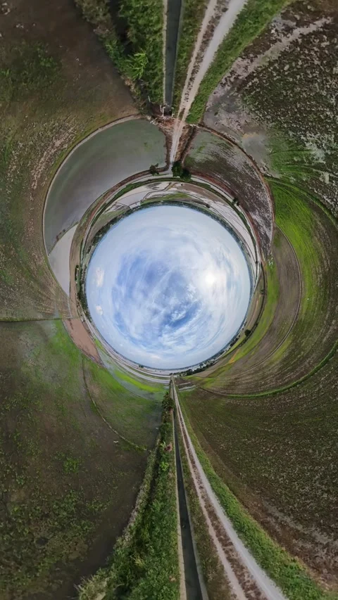 Aerial view swirls into a circular sky Stock Footage 345408404