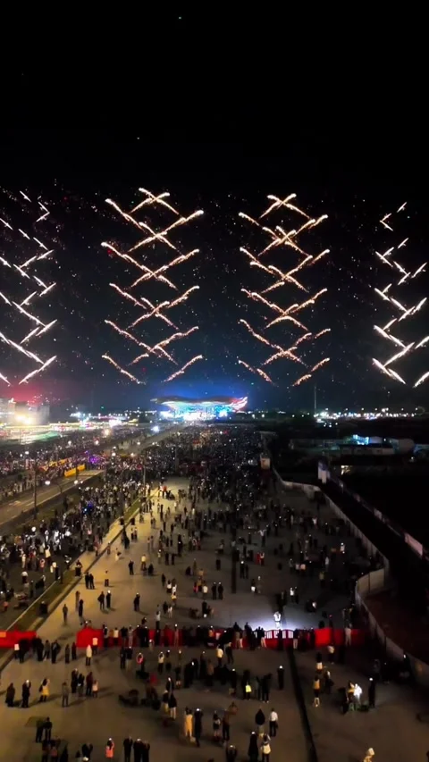 Aerial View of Symmetrical Cross-Pattern Fireworks for Chinese New Year Cele Video stock 329079133