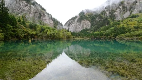 Aerial View of Symmetrical Reflection of Lake in Jiuzhaigou Sichuan China Video stock 336884638