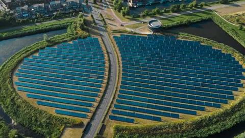 Aerial View of Symmetrical Solar Panel Array and Smart Infrastructure Stock Footage 336562437
