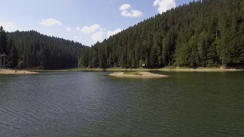 Aerial view of the synevyr lake. The largest lake in the Carpathians Stock Footage