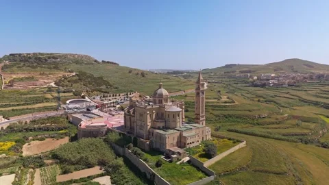 Aerial view of Ta' Pinu Basilica in Gozo amid terraced rural landscape Video stock 341387448