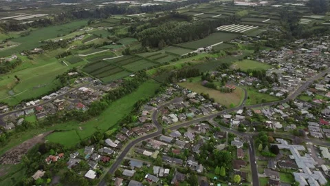 Aerial view of Te Puke, New Zealand, showcasing suburban neighborhoods, curving Stock Footage 305460060