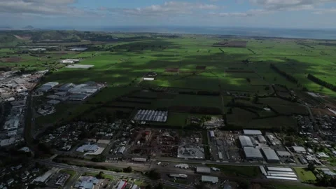 Aerial view of Te Puke, New Zealand, showcasing a blend of urban and rural Stock Footage 305465211
