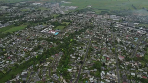 Aerial View of Te Puke Township and Surrounding Farmland, New Zealand Stock Footage 300753410