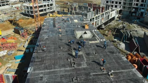 Aerial view of teamwork of manual workers at construction site at summer day 库存影片 144285777