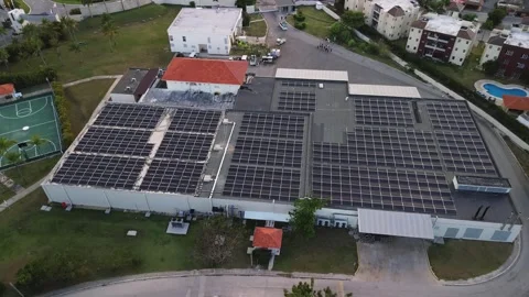 Aerial view of technical building with solar panels on flat roof Leftward Flight Stock Footage 269972974